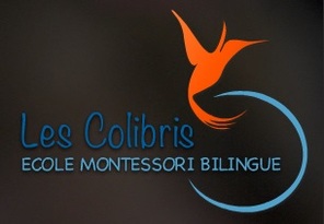 Logo of Les Colibris Ecole Montessori Internationale, black background with blue cursive letters and an orange cartoon hummingbird flying above the words.